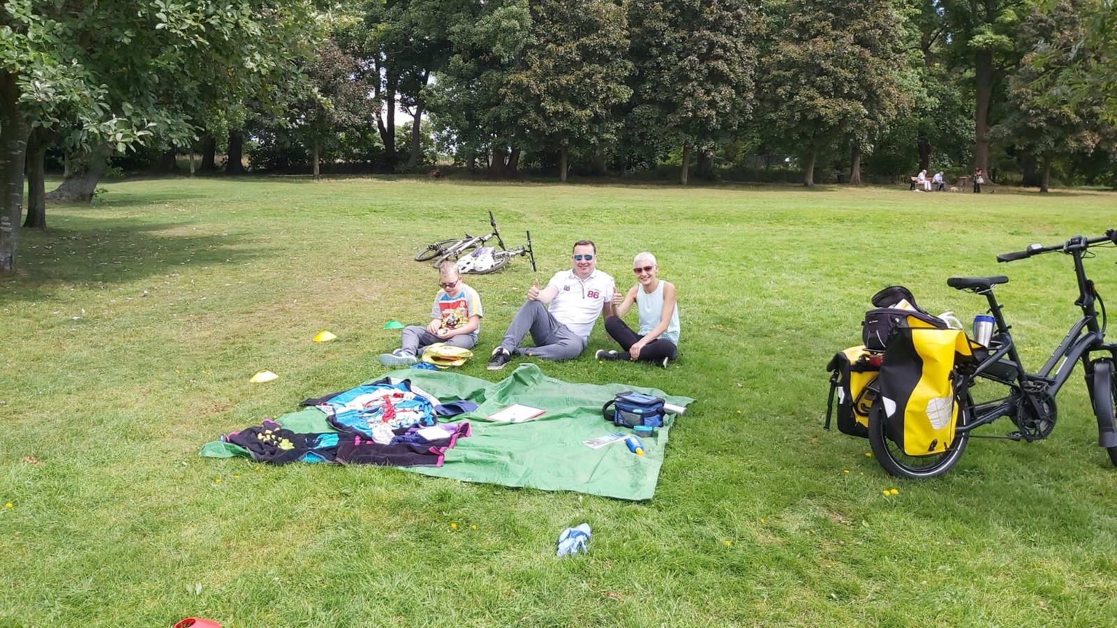 Josh enjoying a picnic in the park after a cycle ride