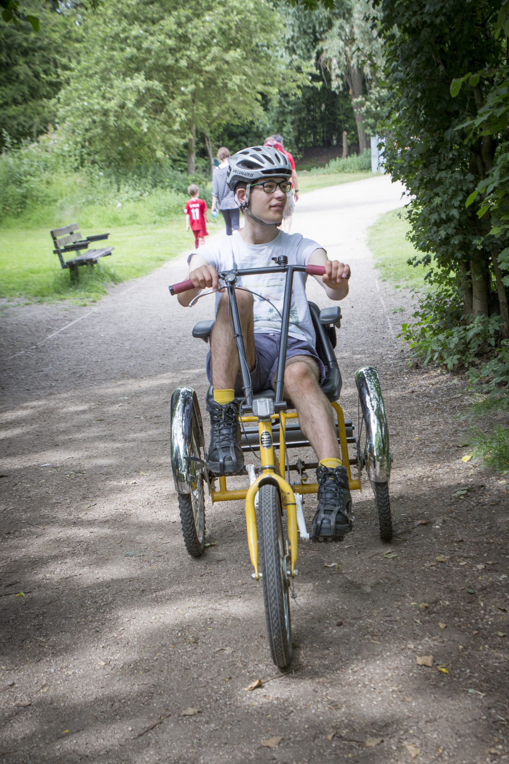 A boy cycling on a trike